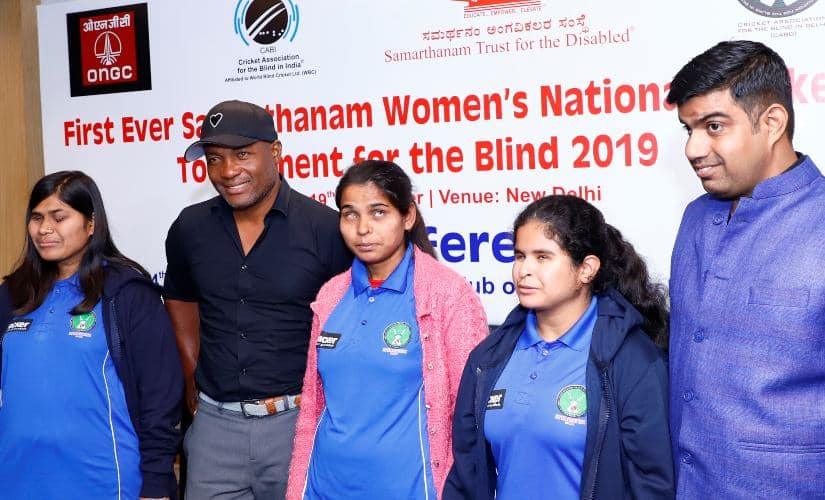 Delhi Blind Women’s team Captain Ankitha (Left) with cricketing legend Brian Lara (C) ahead of first-ever Samarthan Women’s National Cricket Tournament for the Blind in Delhi on Saturday. 