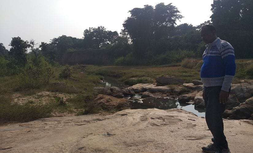 Shibu Albert Horro, an activist in Khunti’s Karra block, stands at the spot a specially-abled man was lynched to death in September. Firstpost/Natasha Trivedi