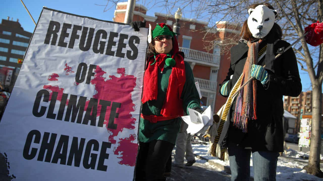 A group calling themselves Climate Change Refugees gathered on 17th Avenue in Calgary, Alberta on December 8th, 2007 for the International Day of Action on Climate Change. Image credit: Flickr/Visible Hand