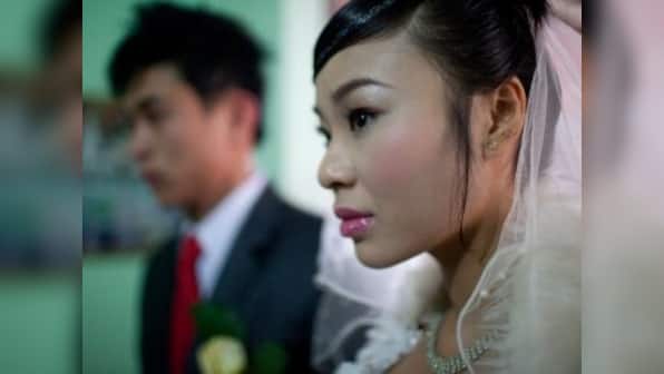 China's skewed sex ratio is prompting men to look for brides in Vietnam, resulting in stories of fraud, love and trafficking