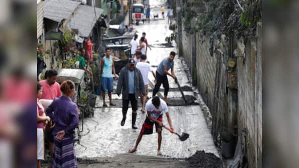 Lava gushes from Philippine volcano as ashfall spreads to Manila, forcing people to flee; city's airport, schools, offices shut