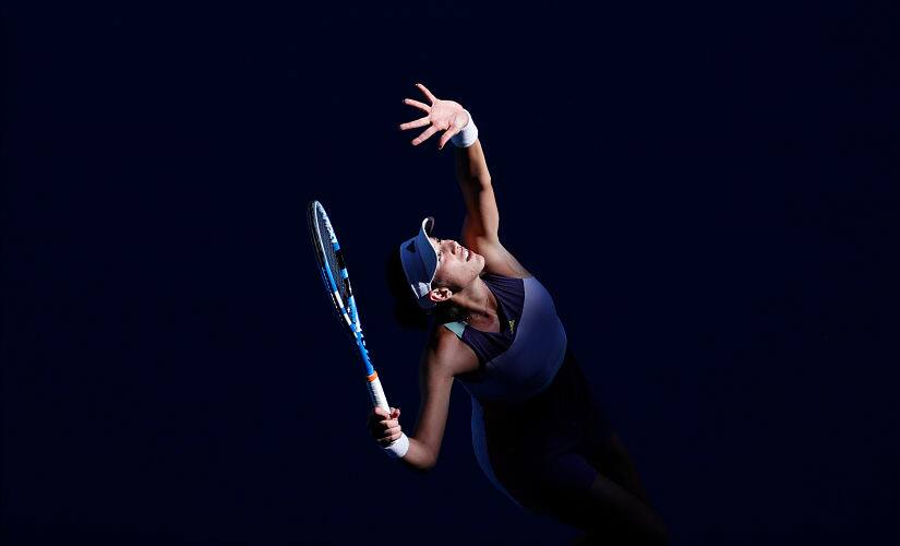 Garbine Muguruza serves to Simona Halep during their Australian Open semi-final. AP Photo