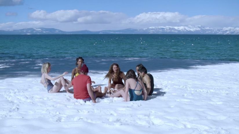 For the ‘Hof method’ a group of Goop staff members did yoga on the banks of Lake Tahoe. Image via The Conversation/ Netflix