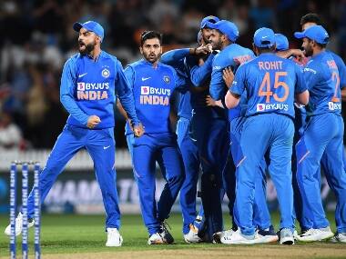 Mohammed Shami is surround by his teammates after he successfully defended nine runs in the final over to take the game in tie-breaker. AP
