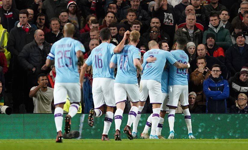 Manchester City players celebrate after scoring. AP