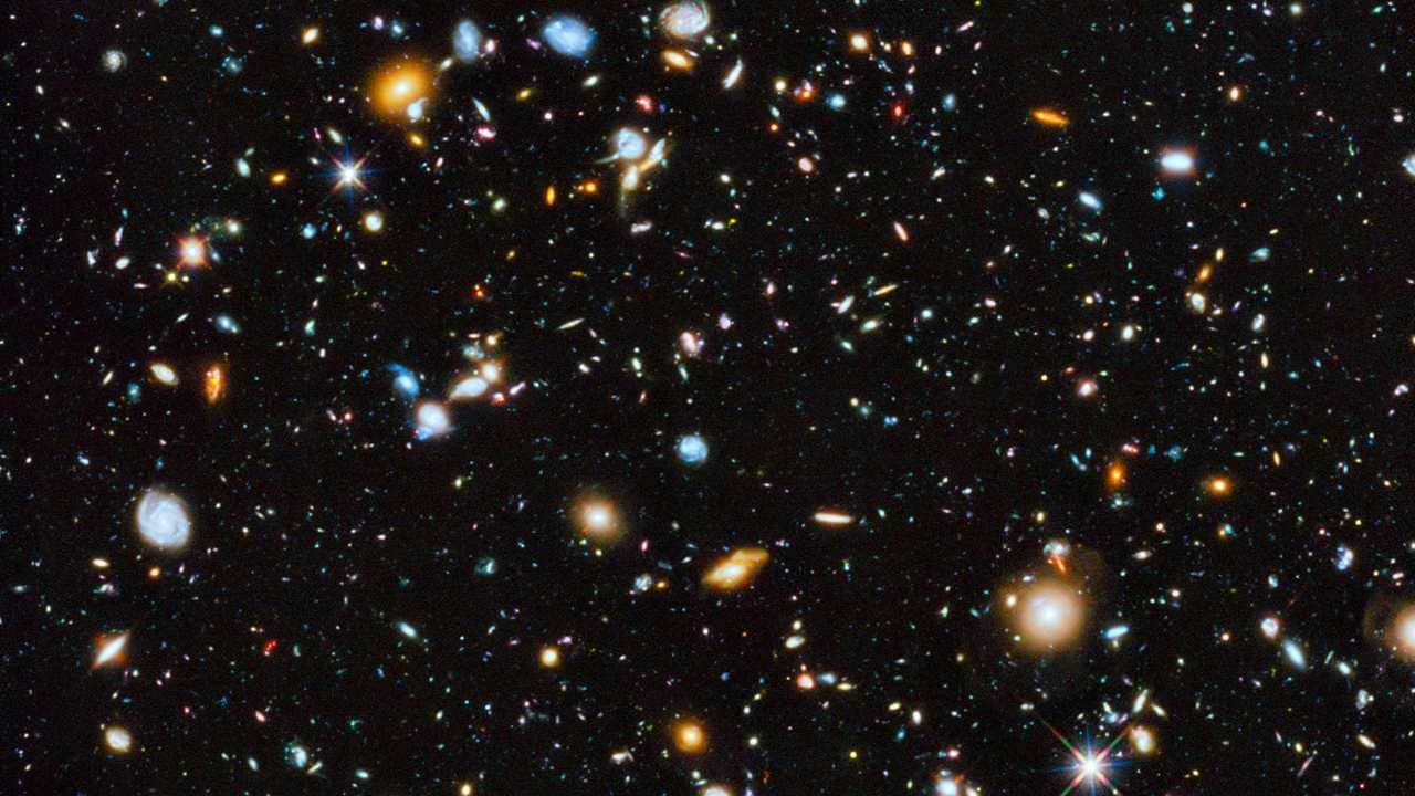 Astronomers using the Hubble Space Telescope have captured the most comprehensive picture ever assembled of the evolving Universe — and one of the most colourful. The study is called the Ultraviolet Coverage of the Hubble Ultra Deep Field (UVUDF) project. Image credit: ESA/Hubble