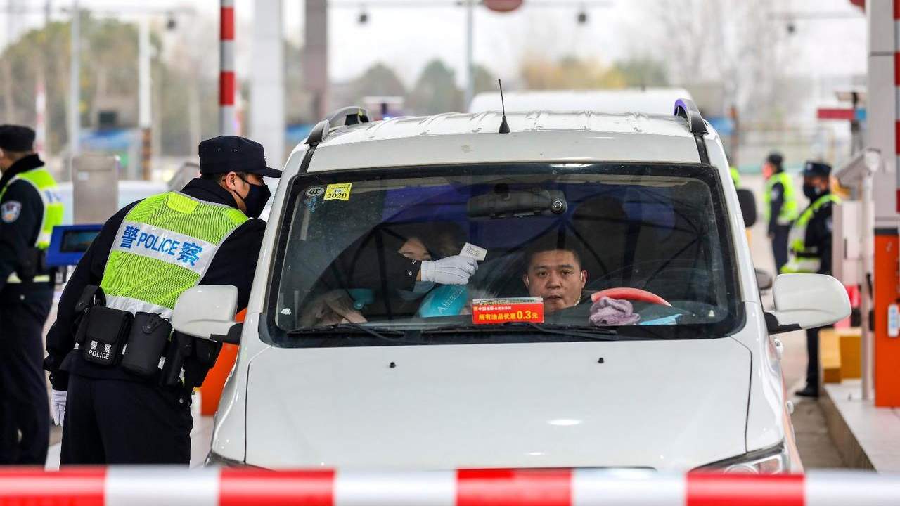All incoming and outgoing traffic is checked while China went into lockdown. Image credit: AP