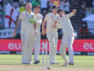 England’s Ben Stokes, left, Jos Buttler, second left, and Joe Root, right, celebrate after beating South Africa in the second cricket test between South Africa and England at the Newlands Cricket Stadium in Cape Town, South Africa. AP