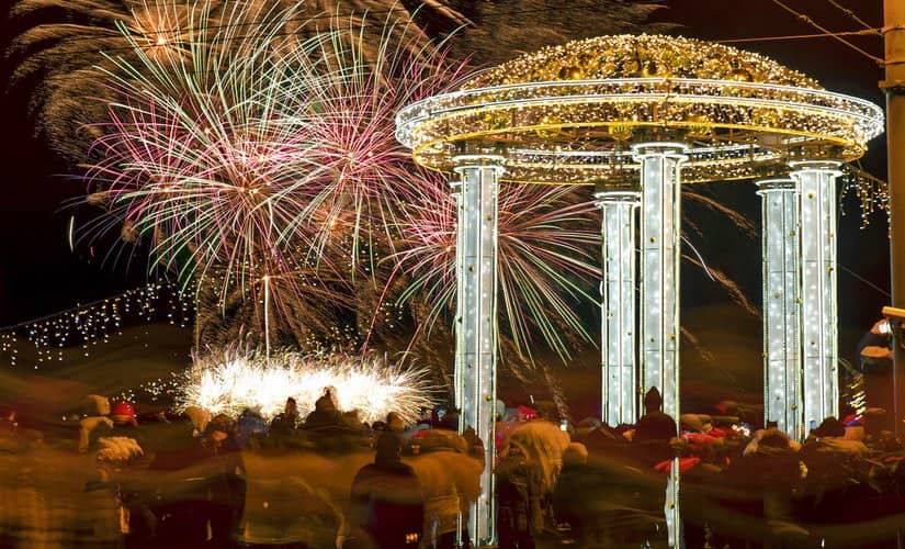 People watch fireworks during New Year celebration in downtown St.Petersburg, Russia. AP