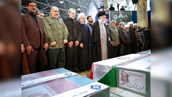 Thousands gather in Tehran for Qassem Soleimani's funeral; Iranian general daughter warns of 'dark day' for US
