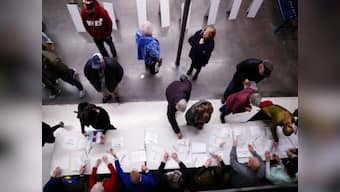 Caucus voting underway across Iowa with Democratic field likely to clarify; polls suggest Bernie Sanders may have narrow lead
