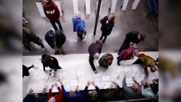 Caucus voting underway across Iowa with Democratic field likely to clarify; polls suggest Bernie Sanders may have narrow lead