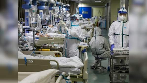 China coronavirus toll stands at 908 with rise in cases following sharp dip on Saturday; WHO experts likely to visit by Tuesday