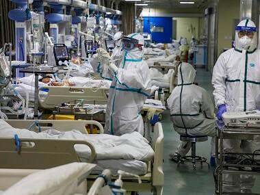China coronavirus toll stands at 908 with rise in cases following sharp dip on Saturday; WHO experts likely to visit by Tuesday
