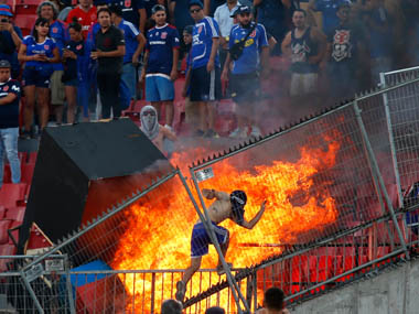 Chilean protestors set fire to seats, pelt police with missiles at Copa Libertadores match between Universidad de Chile and Internacional Chilean protestors set fire to seats, pelt police with missiles at Copa Libertadores match between Universidad de Chile and Internacional