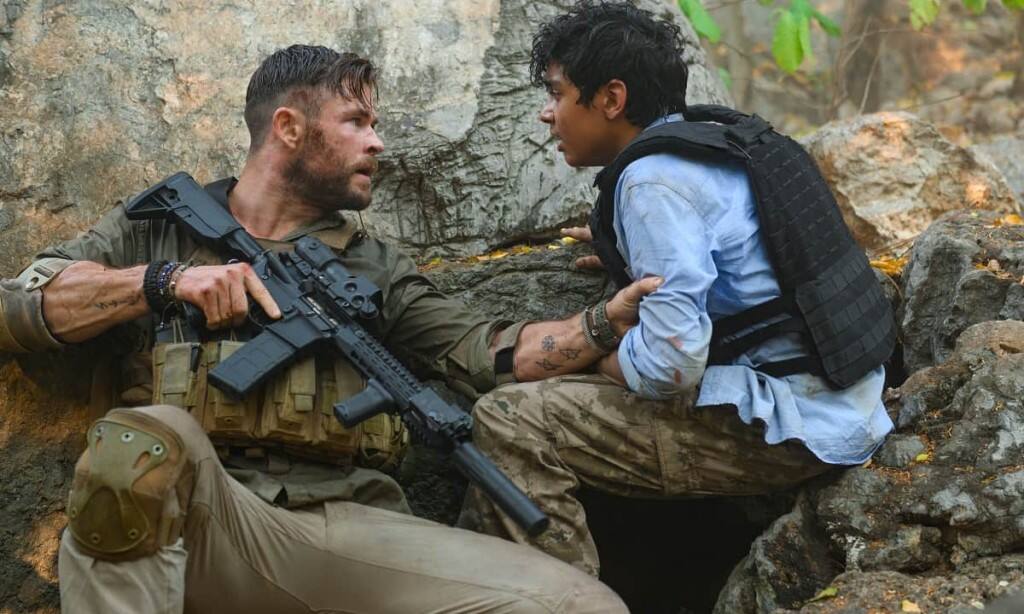 Chris Hemsworth and Rudraksh Jaiswal in a still from Extraction
