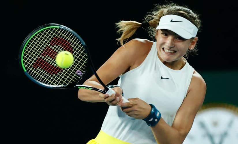 Andorra's Victoria Jimenez Kasintseva makes a backhand return to Poland's Weronika Baszak during the junior girls' final at the Australian Open tennis championship in Melbourne, Australia, Saturday, Feb. 1, 2020. (AP Photo/Dita Alangkara)