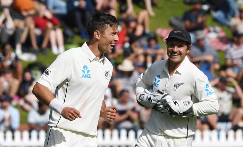 New Zealand’s Trent Boult, left, with BJ Watling celebrates bowling India’s Cheteshwar Pujara for 11 during the first Test between India and New Zealand at the Basin Reserve in Wellington, New Zealand. AP