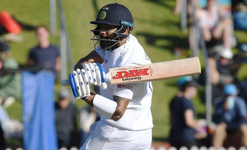 India's Virat Kohli sweeps around to be caught off the bowling of New Zealand's Trent Boult for 19 during the first cricket test between India and New Zealand at the Basin Reserve in Wellington, New Zealand, Sunday, Feb. 23, 2020. (AP Photo/Ross Setford)