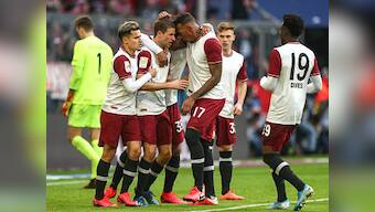 Bundesliga: Bayern Munich beat Augsburg to take 4-point lead in match marked by celebrations and protests