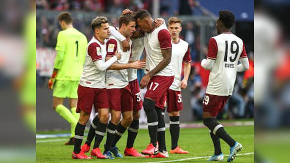 Bundesliga: Bayern Munich beat Augsburg to take 4-point lead in match marked by celebrations and protests