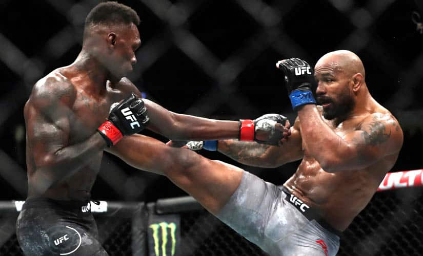 Yoel Romero kicks UFC middleweight champion Israel Adesanya during UFC 248. AP