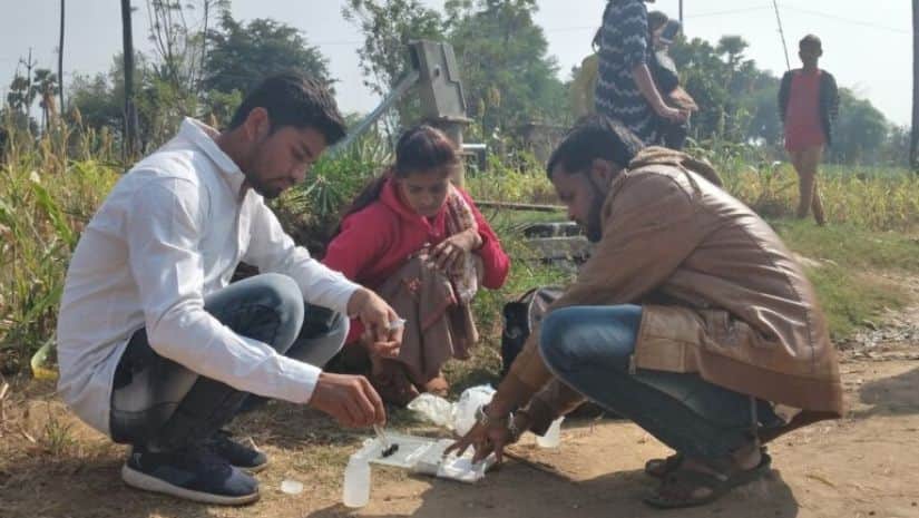 Both women and men were eager to learn the science of fluoride testing in water. Image via Mongabay-India/ Sahana Ghosh