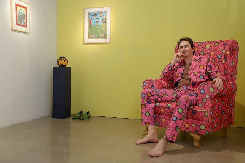 Alexander Gorlizki sits as a part of his installation Otherworldly Interiors.