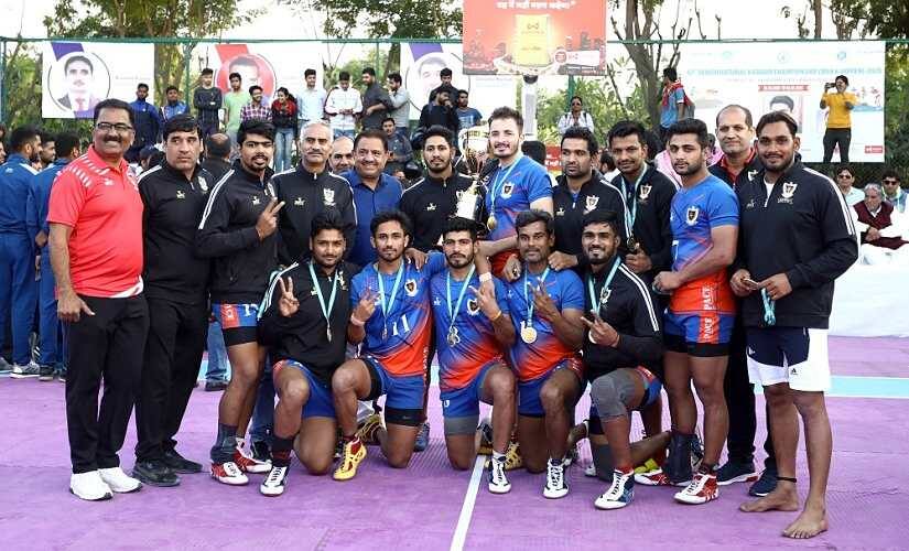 Railways’ men’s team poses with the trophy.