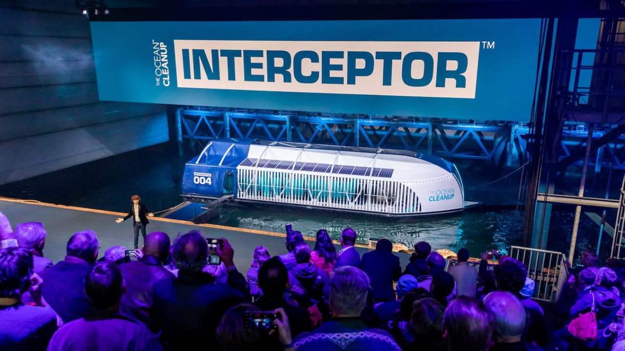 Byan Slat, founder of the Ocean Cleanup, introduces the Interceptor during its unveiling event on Oct. 26, 2019, in Rotterdam, The Netherlands. Image courtesy of The Ocean Cleanup.