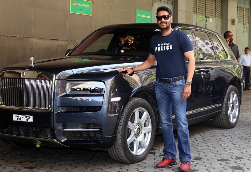 Ajay Devgn poses alongside a luxurious car | Sachin Gokhale