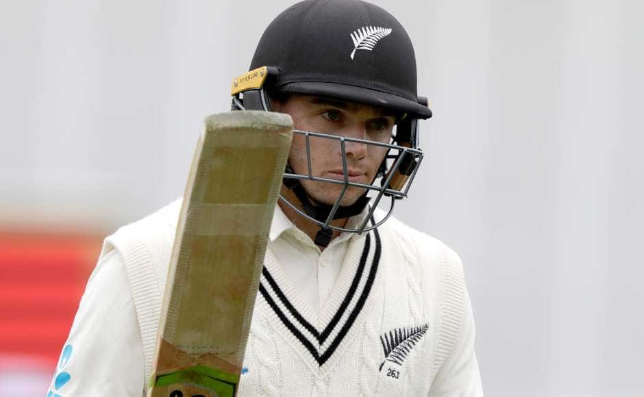 Tom Latham raises his bat after scoring a fifty. AP 