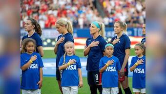 US Soccer apologises for arguments in equal pay case as women footballers hide federation's logo in apparent protest