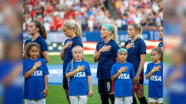 US Soccer apologises for arguments in equal pay case as women footballers hide federation's logo in apparent protest
