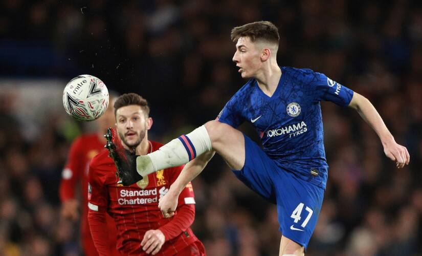 Chelsea’s Billy Gilmour, right, controls the ball past Liverpool’s Adam Lallana during the English FA Cup fifth round match between Chelsea and Liverpool. AP