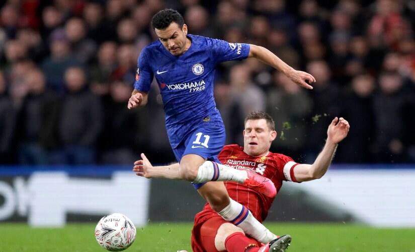 Chelsea’s Pedro, left, is tackled by Liverpool’s James Milner during the English FA Cup fifth round match between Chelsea and Liverpool. AP