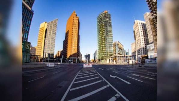 Lockdowns multiply globally as coronavirus strains health systems; three US cities, Germany's Bavaria move to restrict residents