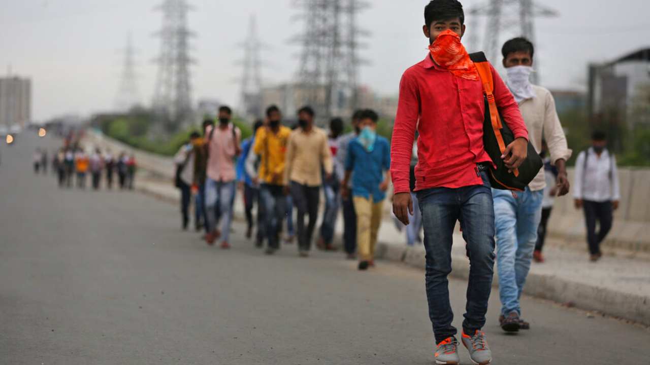 Groups of Indian daily wage labourers walk along an expressway in Delhi-NCR region hoping to reach their homes following a 21-day lockdown due to coronavirus. AP