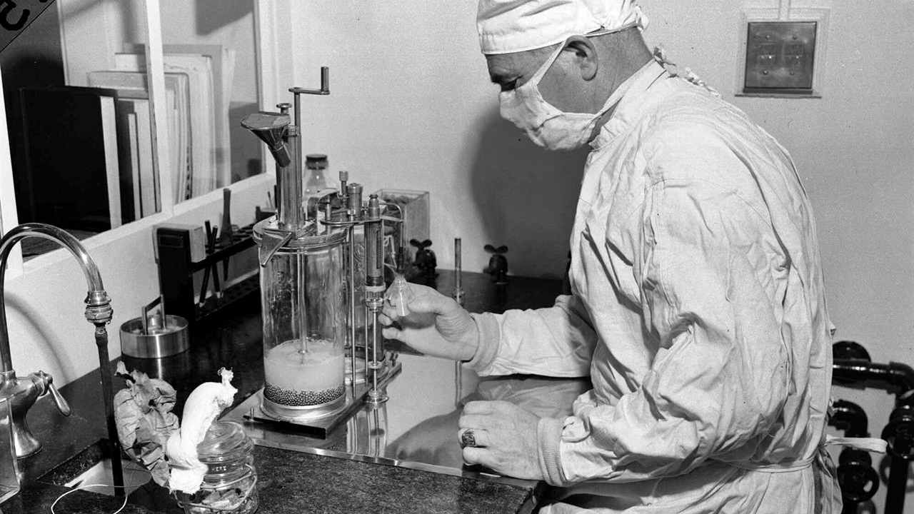 In this Dec. 2, 1947 file photo, Charles D. Brown, fills a vial with the BCG tuberculosis vaccine, at a state-operated laboratory in Albany, N.Y. Image credit: AP