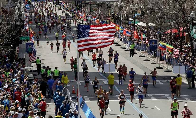 File image of runners heading down the stretch to the finish line in the 121st Boston Marathon. AP