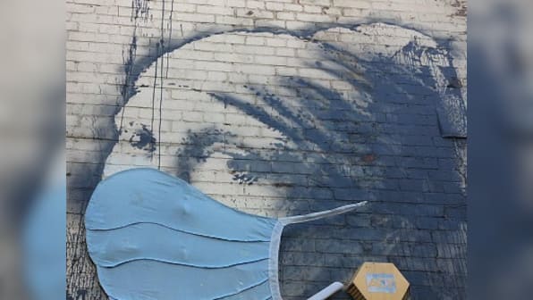 Coronavirus Outbreak: Banksy's mural, Girl with a Pierced Eardrum, based in his hometown Bristol now gets a face mask