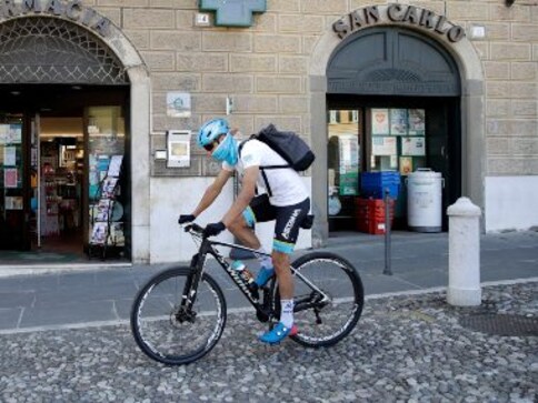 Coronavirus Outbreak: Professional cyclist Davide Martinelli using cycle to deliver medicie to elderly residents in Lodetto, Italy Coronavirus Outbreak: Professional cyclist Davide Martinelli using cycle to deliver medicie to elderly residents in Lodetto, Italy