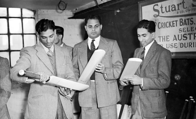 (L-R) India's CS Nayudu, Shute Banerjee and Chandra Sarwate examine cricket bats (Photo via Getty Images)
