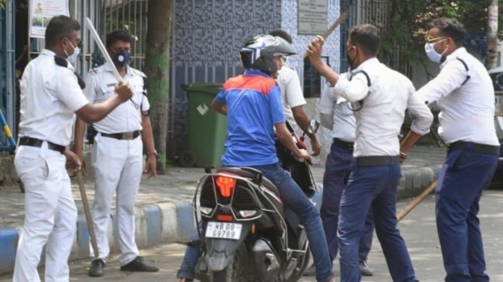 The police beating a man on a scooter