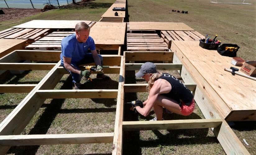 US pole vault hopeful Sandi Morris works on vaulting pit she is building with her father Harry Morris. AP