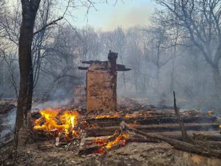 Ukrainian firefighters battle two blazes near Chernobyl nuclear power plant; over 60 acres of forest affected