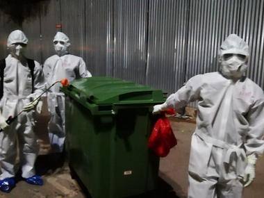 Cleaning staff take bins to disposal area. Pic courtesy: Govt Medical College and Hospital, Kalamassery, Ernakulam.