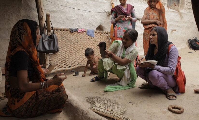 Khabar Lahariya reporters covering plight of migrant workers in Mahoba. Image Courtesy: Black Ticket Films