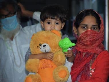 A woman holds her child at the quarantine centre. Firstpost/Ismat Ara