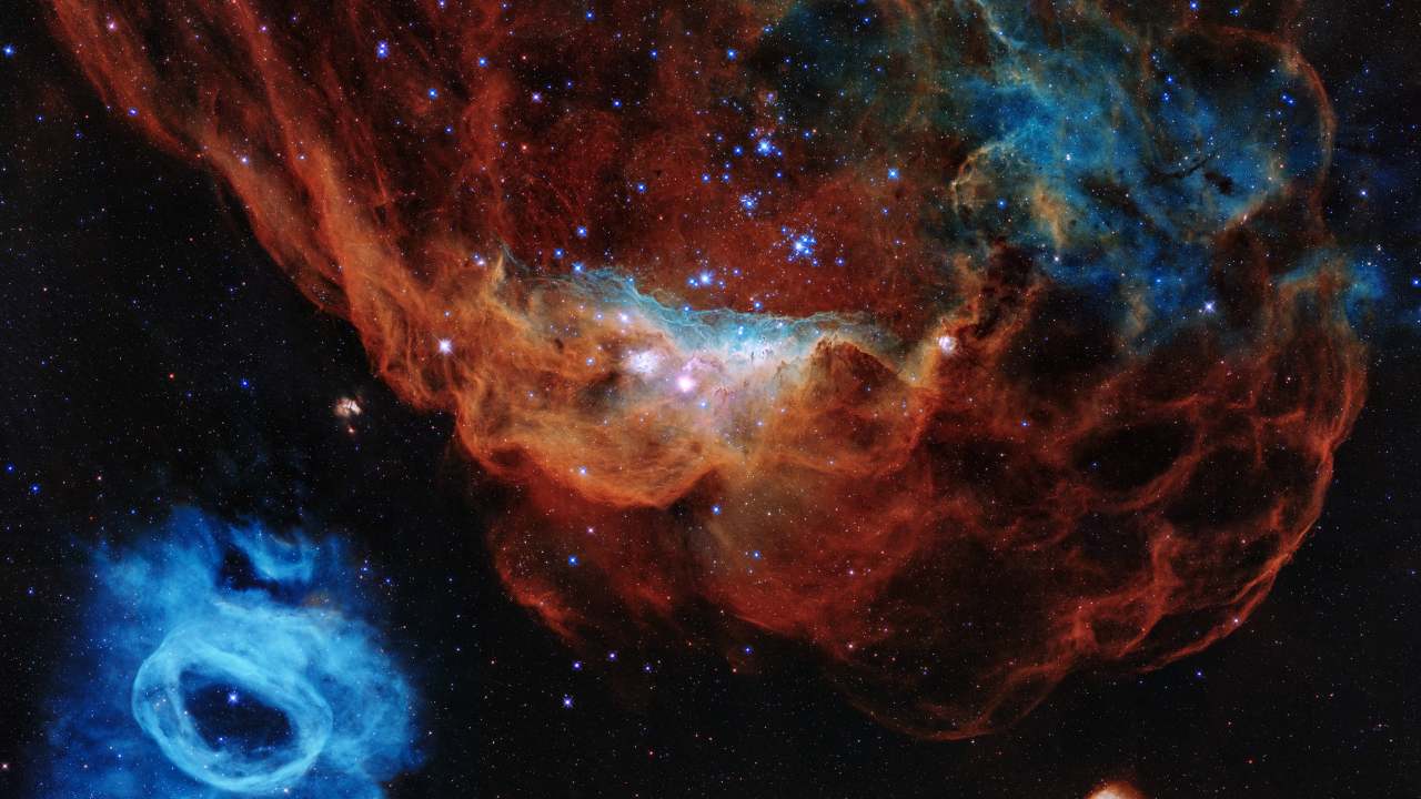 A colorful image resembling a cosmic version of an undersea world teeming with stars is being released to commemorate the Hubble Space Telescope's 30 years of viewing the wonders of space. Image credit: NASA, ESA and STScI